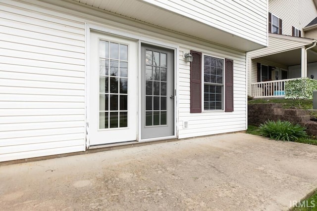 property entrance featuring a patio