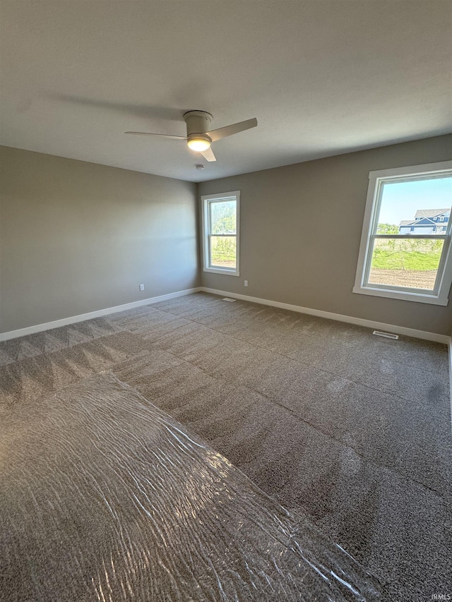 5115 Bankside Ct, Mishawaka, IN 46544 - empty room featuring baseboards, ceiling fan, and carpet floors