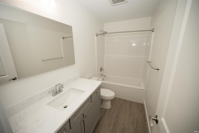 5115 Bankside Ct, Mishawaka, IN 46544 - bathroom with toilet, wood finished floors, vanity, and  shower combination