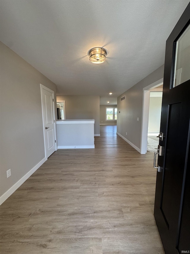 5115 Bankside Ct, Mishawaka, IN 46544 - unfurnished living room featuring baseboards and light wood finished floors