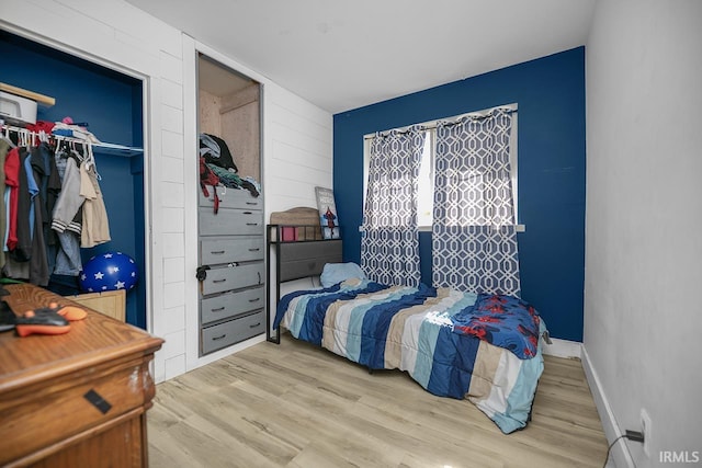 56626 Miller Dr, Elkhart, IN 46516 - bedroom featuring a closet, baseboards, and wood finished floors