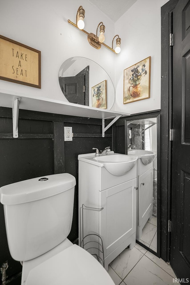 56626 Miller Dr, Elkhart, IN 46516 - bathroom with vanity, marble finish floor, and toilet