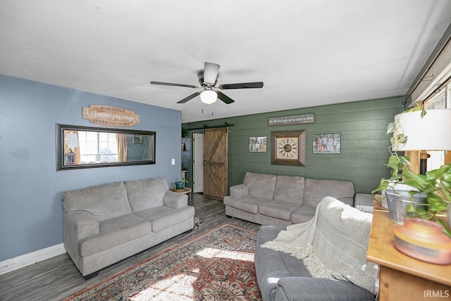 56626 Miller Dr, Elkhart, IN 46516 - living area with a barn door, baseboards, a ceiling fan, and wood finished floors