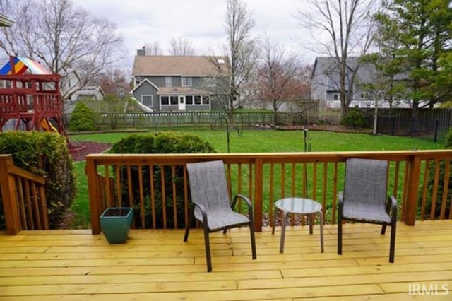 455 Lagrange St, West Lafayette, IN 47906 - wooden deck featuring a yard, a fenced backyard, and a playground