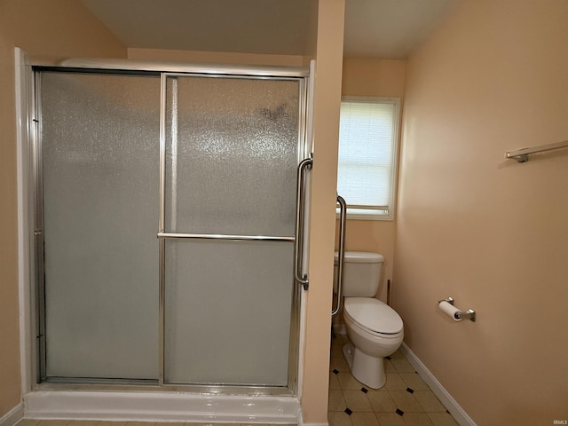119 Leatherwood Creek Ests, Bedford, IN 47421 - bathroom featuring toilet, a shower stall, and baseboards