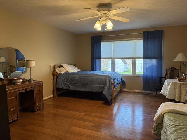 119 Leatherwood Creek Ests, Bedford, IN 47421 - bedroom featuring baseboards, a ceiling fan, and wood finished floors