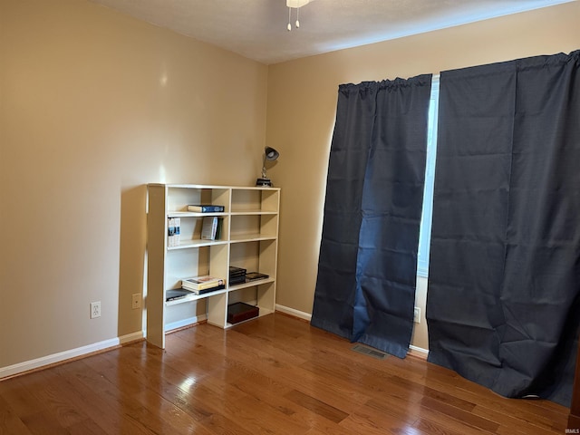 119 Leatherwood Creek Ests, Bedford, IN 47421 - interior space featuring visible vents, baseboards, ceiling fan, and wood finished floors
