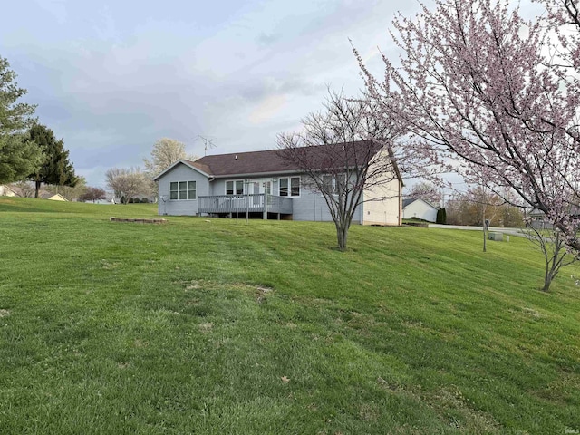 119 Leatherwood Creek Ests, Bedford, IN 47421 - back of property with a yard and a wooden deck