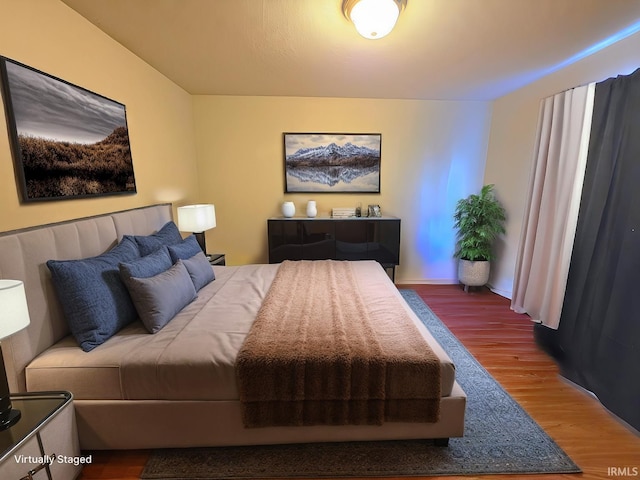 bedroom featuring wood finished floors