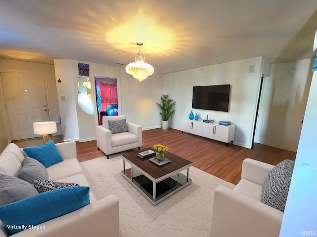 living room featuring wood finished floors and baseboards
