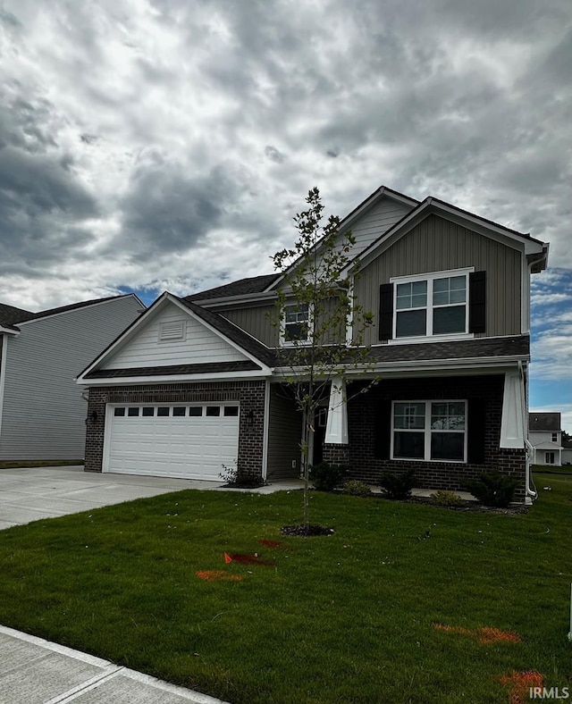view of front of home featuring concrete driveway, a front yard, a garage, and brick siding