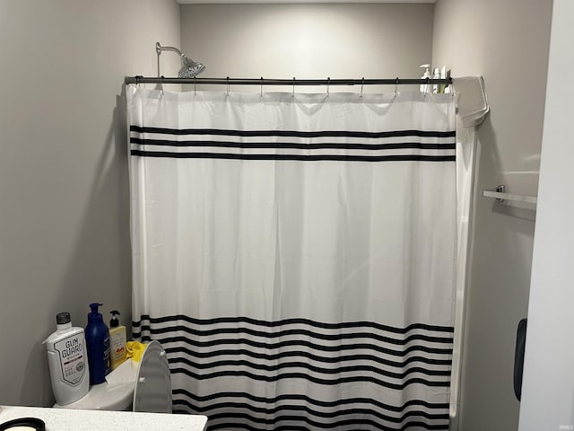 bathroom with a shower with shower curtain