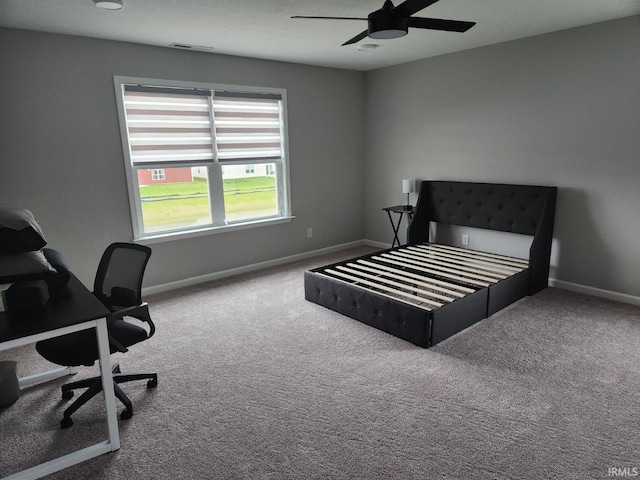 carpeted bedroom featuring ceiling fan, baseboards, and visible vents