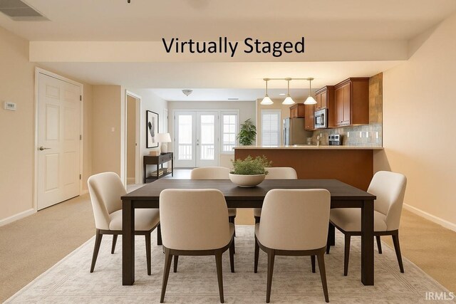 5922 N Ajuga Ct, Ellettsville, IN 47429 - dining area featuring light colored carpet, visible vents, and baseboards