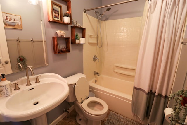 full bath featuring a sink, toilet, and shower / bath combination with curtain