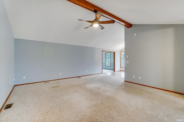 unfurnished room with lofted ceiling with beams, a ceiling fan, visible vents, carpet flooring, and baseboards