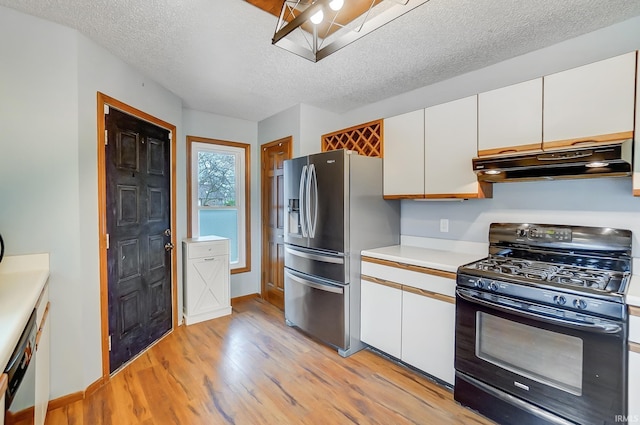kitchen featuring light countertops, under cabinet range hood, white cabinetry, stainless steel appliances, and light wood-style flooring
