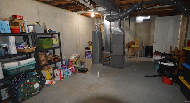 unfinished basement featuring water heater and heating unit