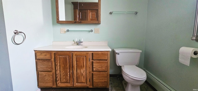126 E 4th St, Mount Carmel, IL 62863 - bathroom with vanity, baseboard heating, and toilet