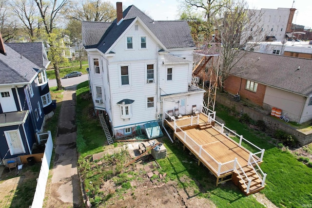 126 E 4th St, Mount Carmel, IL 62863 - back of house with a shingled roof and stairway