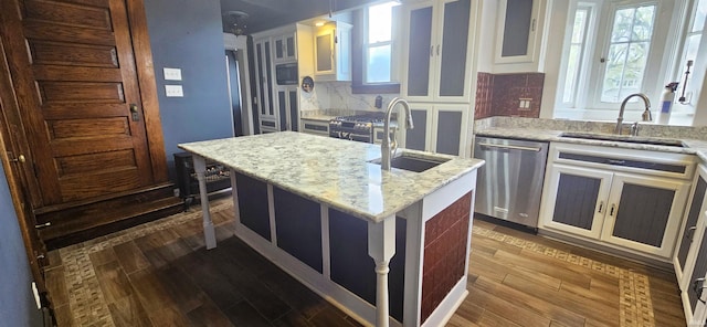 126 E 4th St, Mount Carmel, IL 62863 - kitchen with dark wood-type flooring, appliances with stainless steel finishes, a sink, and backsplash