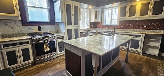 126 E 4th St, Mount Carmel, IL 62863 - kitchen with dark wood-type flooring, a center island, a sink, and stainless steel appliances