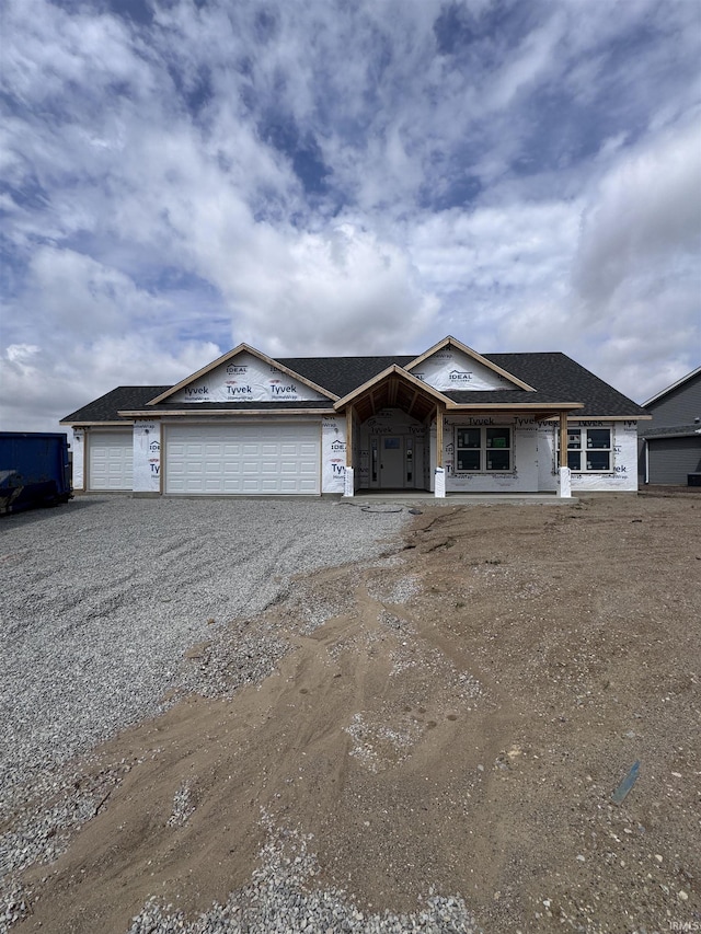 908 Marshall Way N, Manchester, IN 46962 - property in mid-construction featuring a porch, an attached garage, and driveway