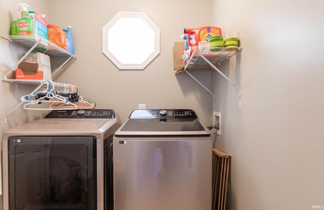 laundry room featuring independent washer and dryer and laundry area