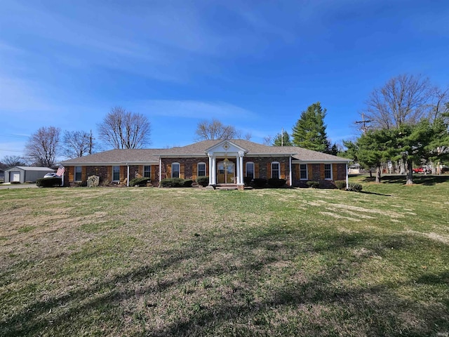 501 Monticello Dr, Vincennes, IN 47591 - view of front facade with a front yard and brick siding