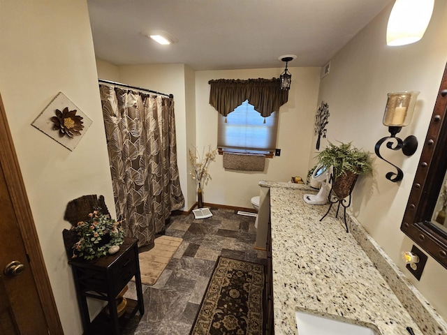 501 Monticello Dr, Vincennes, IN 47591 - bathroom with visible vents, baseboards, curtained shower, toilet, and vanity