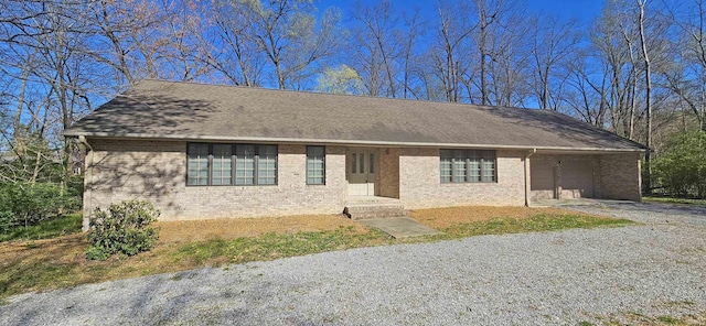 402 Easy St, Mount Carmel, IL 62863 - single story home featuring a shingled roof, gravel driveway, and brick siding