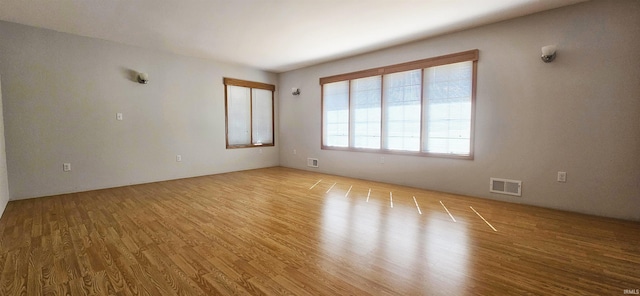 402 Easy St, Mount Carmel, IL 62863 - empty room featuring visible vents and wood finished floors