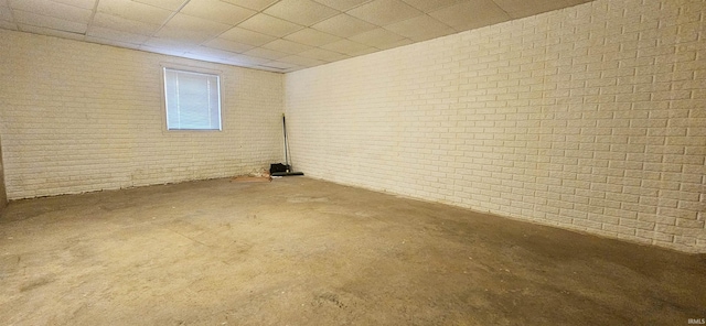 402 Easy St, Mount Carmel, IL 62863 - below grade area featuring brick wall and a paneled ceiling