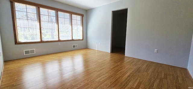 402 Easy St, Mount Carmel, IL 62863 - empty room with visible vents and wood finished floors