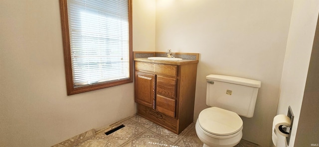 402 Easy St, Mount Carmel, IL 62863 - half bathroom featuring visible vents, toilet, and vanity