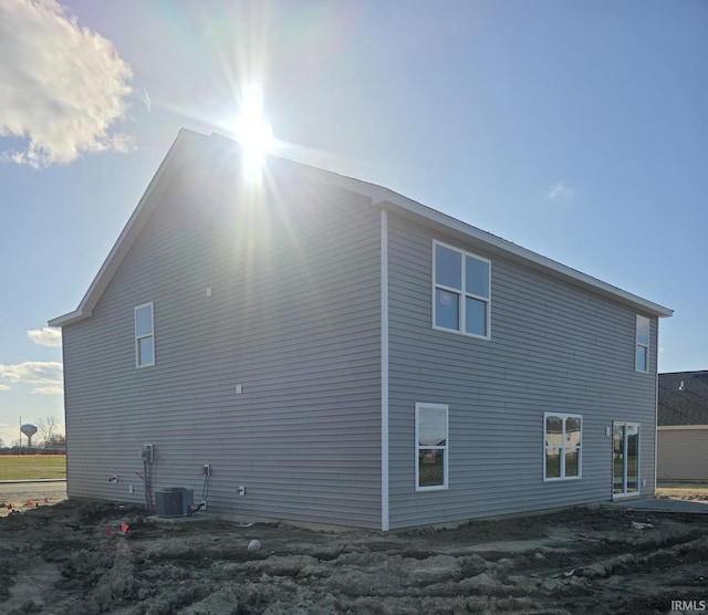 view of side of home featuring central air condition unit
