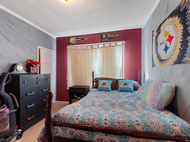 bedroom with a textured ceiling and carpet flooring