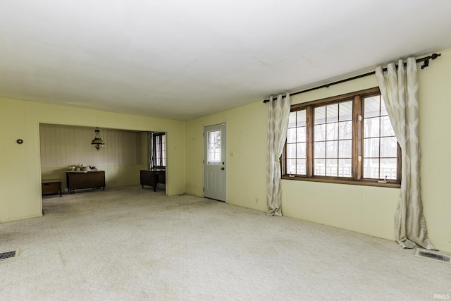 411 S County Road 550 E, Selma, IN 47383 - unfurnished living room with visible vents and carpet