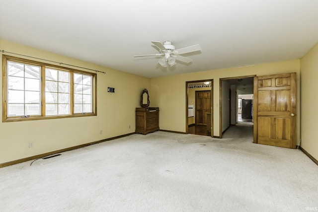 411 S County Road 550 E, Selma, IN 47383 - interior space with light carpet, visible vents, baseboards, and ceiling fan
