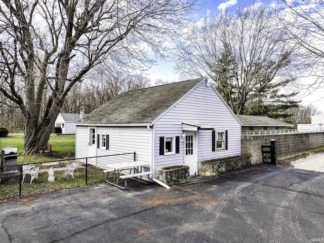 411 S County Road 550 E, Selma, IN 47383 - exterior space featuring a shingled roof and fence