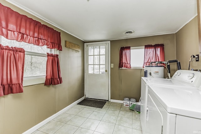 411 S County Road 550 E, Selma, IN 47383 - washroom with visible vents, light tile patterned floors, laundry area, electric water heater, and washing machine and dryer