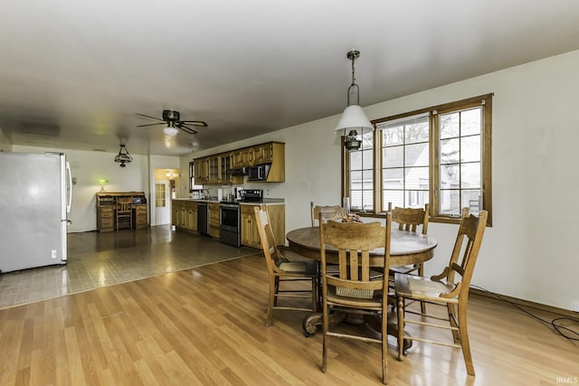 411 S County Road 550 E, Selma, IN 47383 - dining room featuring ceiling fan and wood finished floors