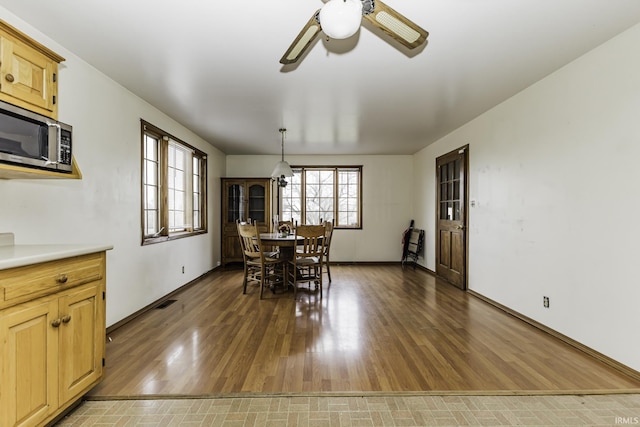 411 S County Road 550 E, Selma, IN 47383 - dining space featuring wood finished floors, ceiling fan, and visible vents