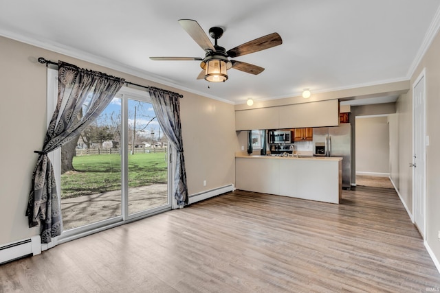 unfurnished living room with a baseboard radiator, baseboards, ornamental molding, and wood finished floors