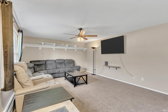 carpeted living room featuring baseboards and a ceiling fan