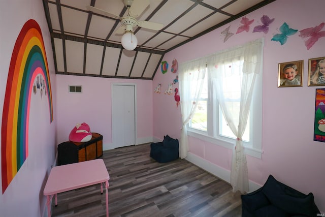 interior space with visible vents, wood finished floors, and lofted ceiling
