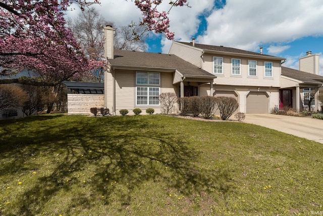 526 Cambridge Dr, Kokomo, IN 46902 - view of front of home with a front yard, a chimney, a garage, and concrete driveway