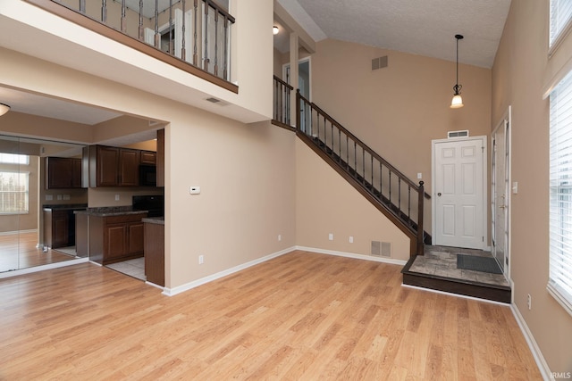 526 Cambridge Dr, Kokomo, IN 46902 - foyer with light wood finished floors, baseboards, and visible vents