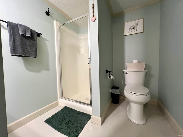 full bath featuring toilet, a stall shower, and baseboards