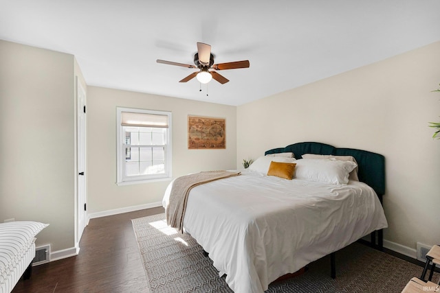 4707 Old Mill Rd, Fort Wayne, IN 46807 - bedroom with dark wood-style flooring, baseboards, a ceiling fan, and visible vents